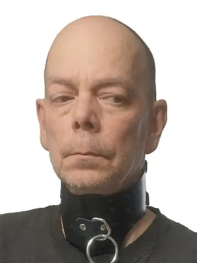 Person selfie wearing a black wide collar around his neck.