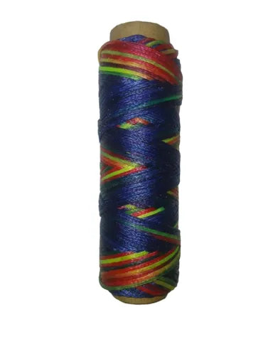 Spool of thread colors of blue green and red