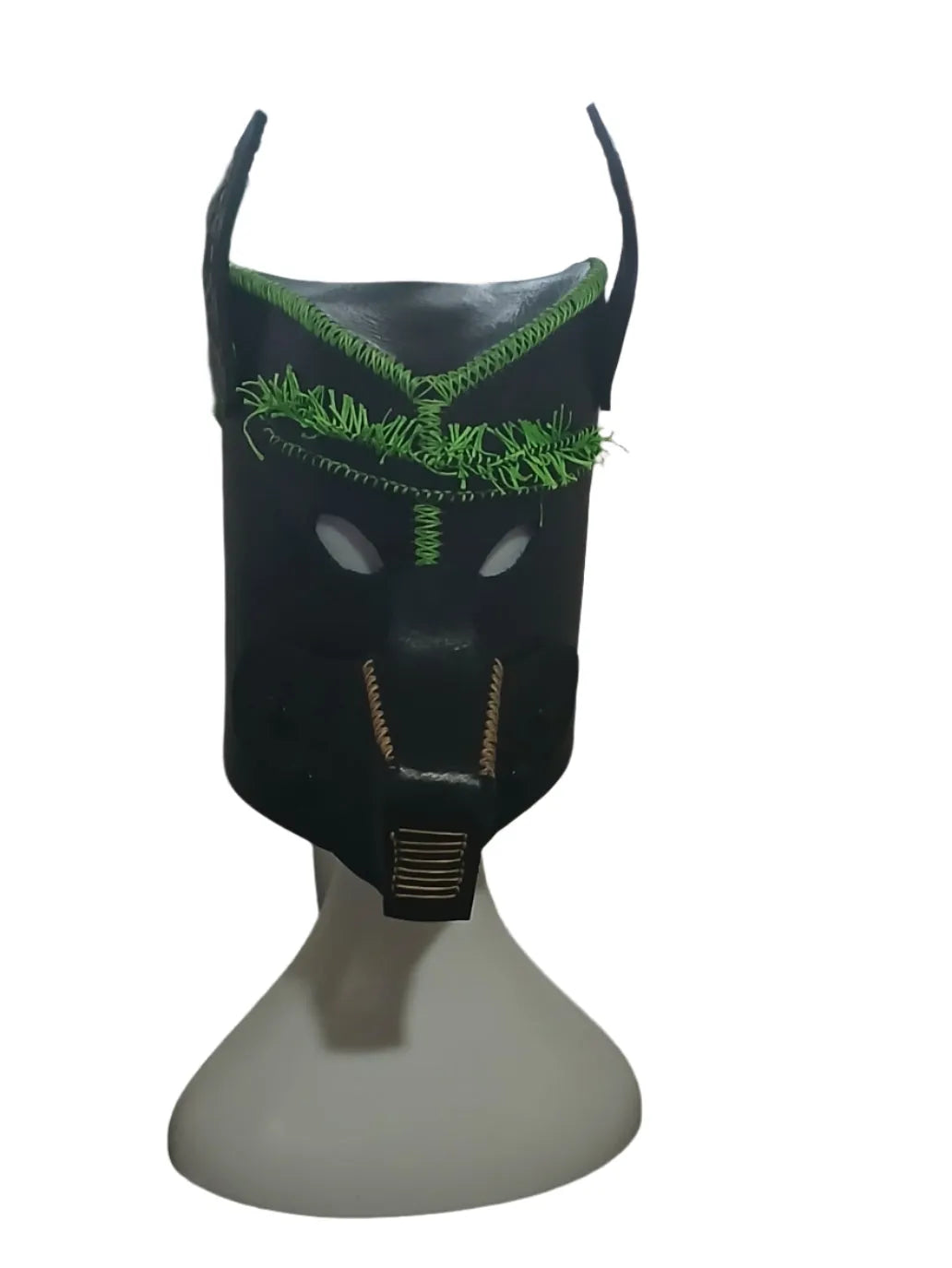 Black mask with green accents on a white background