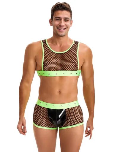 “Male model wearing black fishnet crop and briefs with neon-green studded bands and glossy black pouch.”